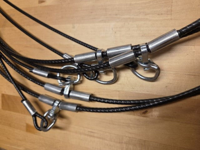 Dog grooming station with multiple adjustable arms and restraints.
