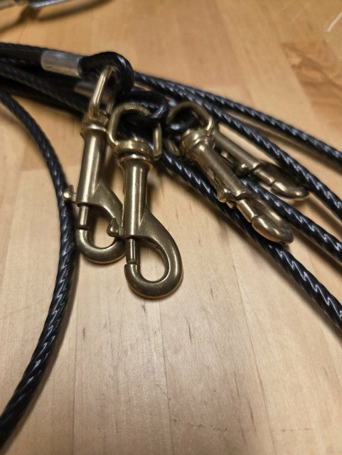 Dog leash holder with multiple hooks for leashes.